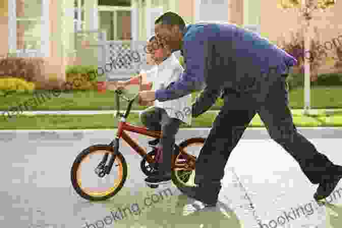 A Father Teaches His Young Son How To Ride A Bike, Providing Encouragement And Support Every Step Of The Way. All Daddies Love Their Babies (Baby Love)