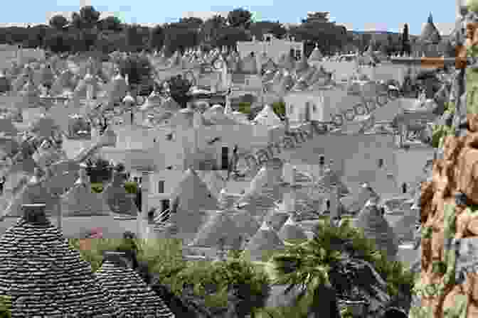 A Picturesque View Of Traditional Trulli Houses In Alberobello, Puglia, With Their Conical Roofs And White Walls. Head Over Heel: Seduced By Southern Italy